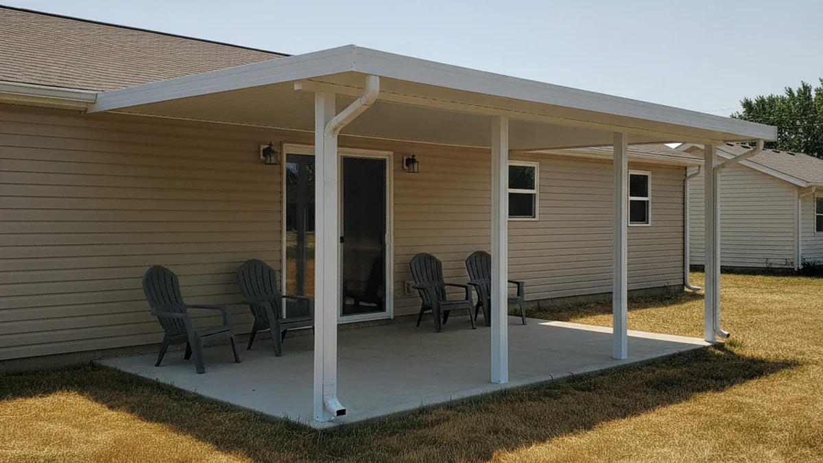 Finished attached patio cover installation on modest Manhattan Kansas home with shaded concrete patio